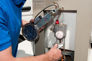 Mike, one of our Ashburn water heater repair pros is fixing a water heater unit